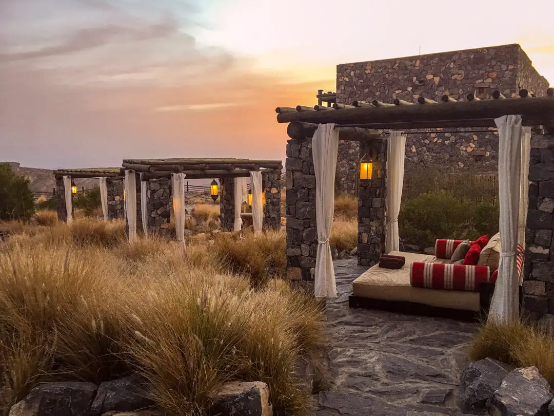 Day beds around the pool at the Alila Jabal Akhdar luxury hotel in Oman