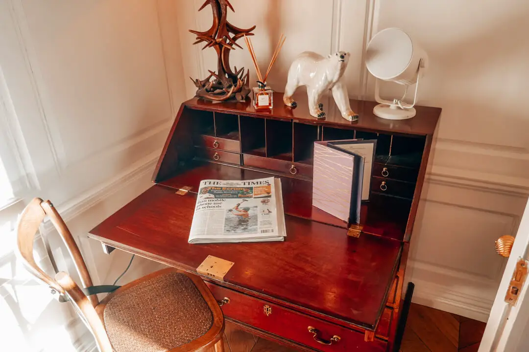 Mahogany desk in the library at Slaughters Manor House, a luxury boutique hotel in the Cotswolds