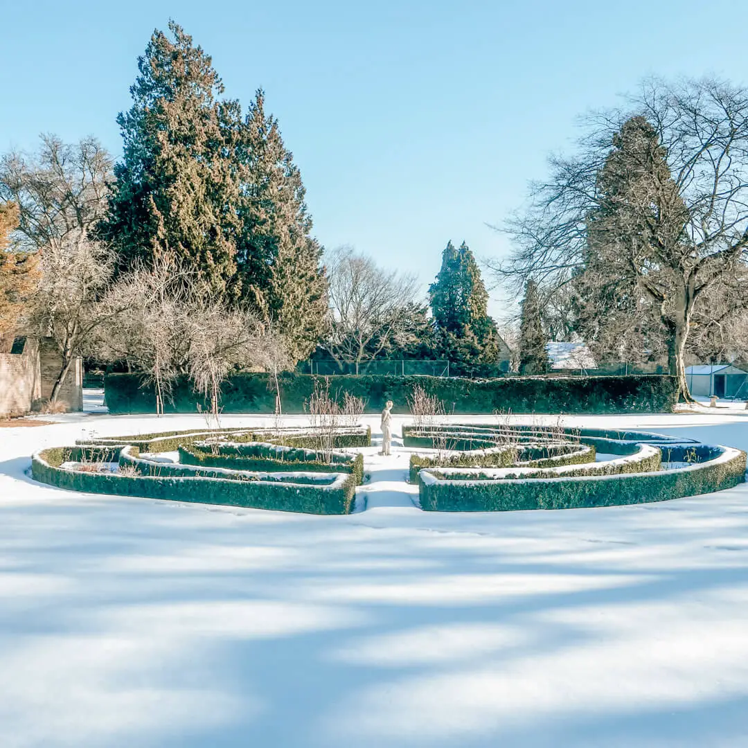 Gardens in the snow at Slaughters Manor House, a luxury boutique hotel in the Cotswolds